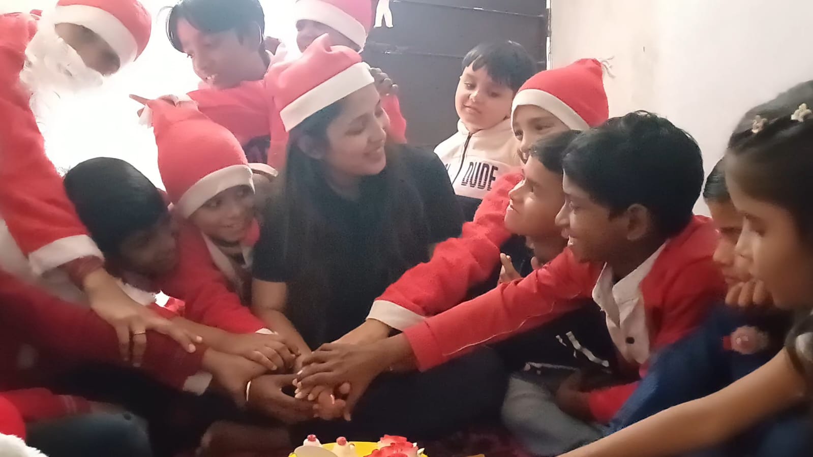 Volunteers interacting with children during an activity