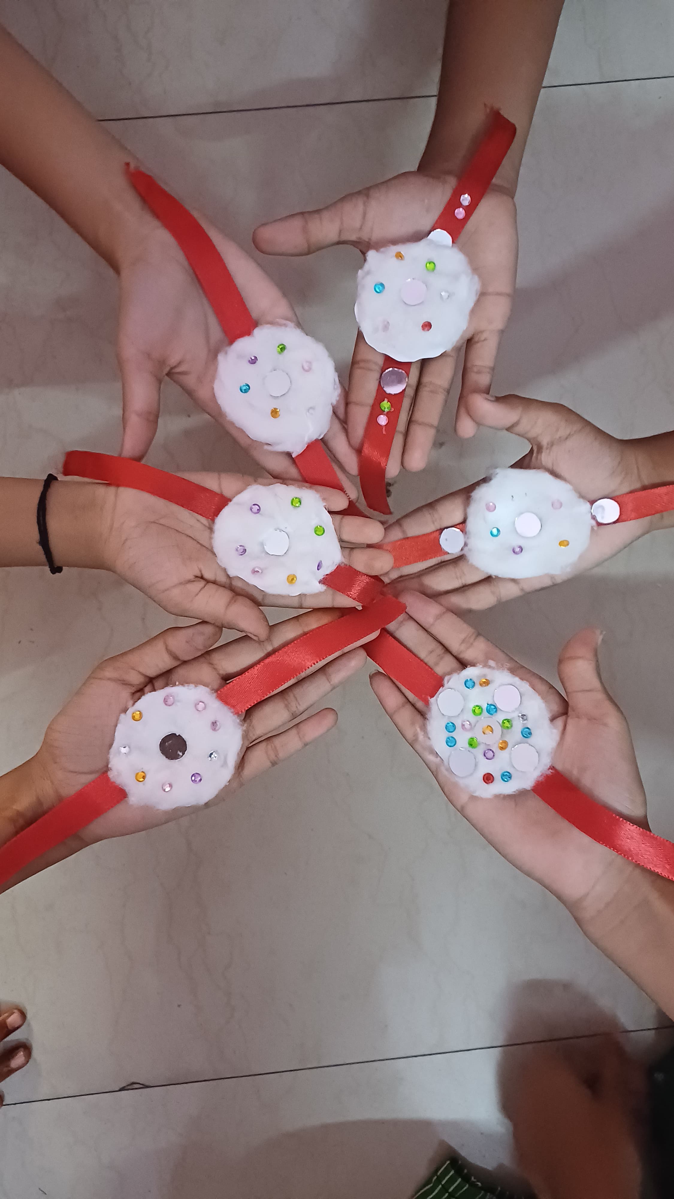 Children receiving gifts and sweets at Raksha Bandhan event