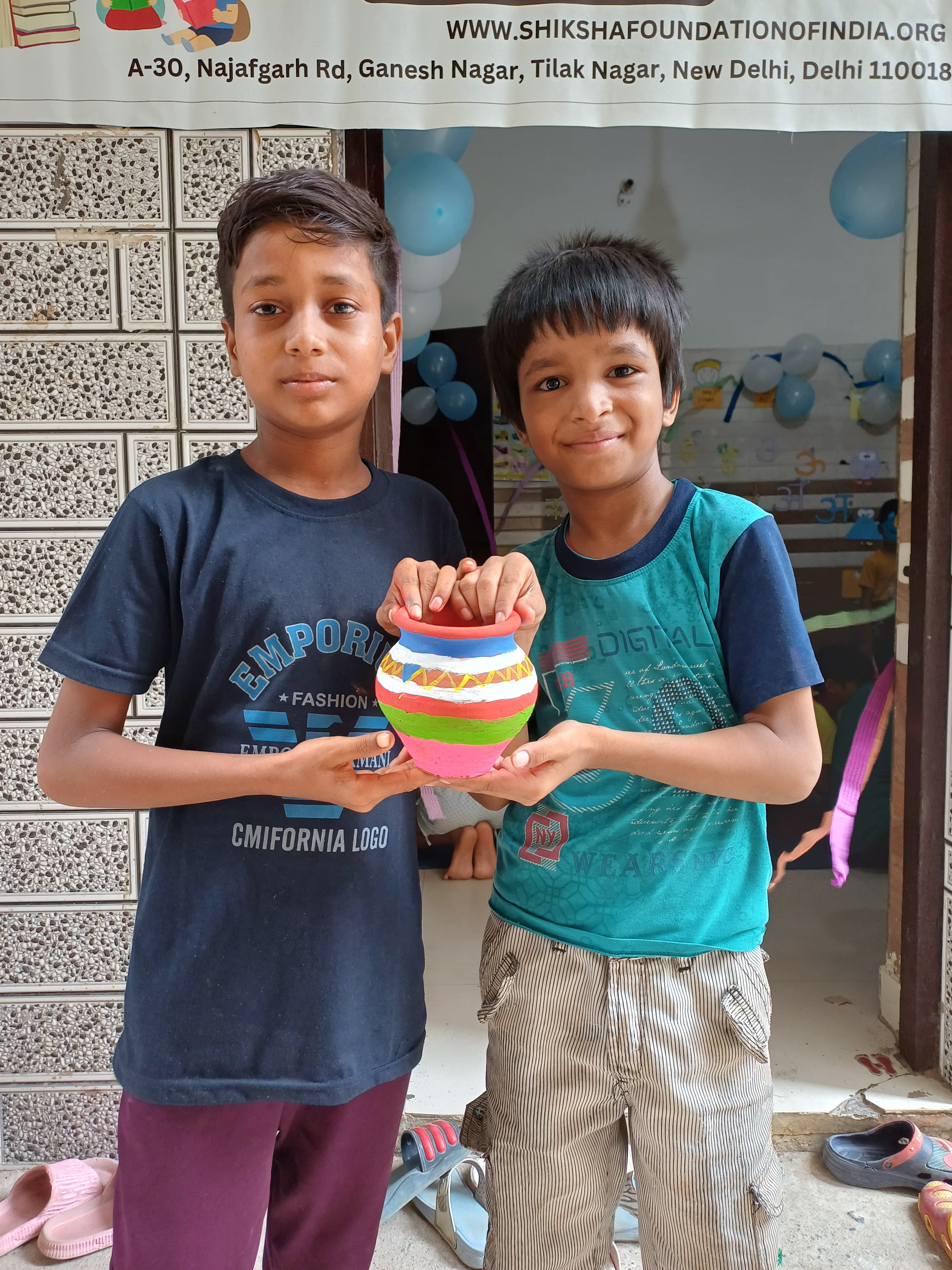 Volunteers teaching children in a classroom setting