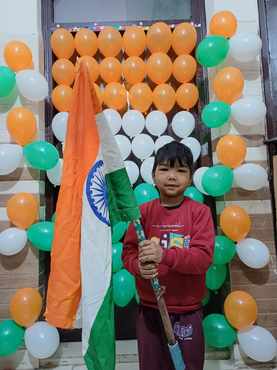 Child celebrating Republic Day with Indian flag