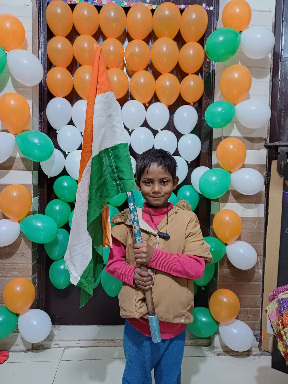 Child proudly waving Indian flag